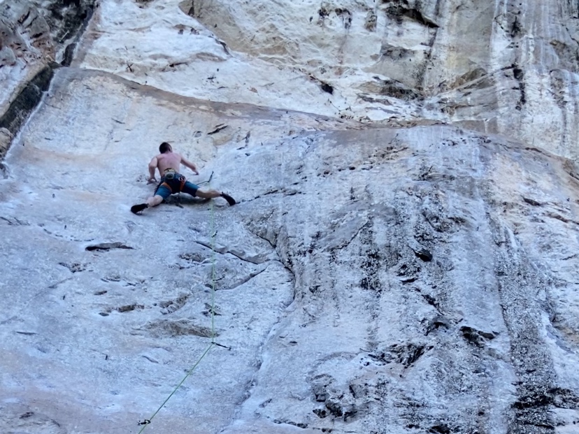 Climber on a white limestone wall at Spirit Mountain 